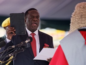 Emmerson Mnangagwa is sworn in as President at the presidential inauguration ceremony in the capital Harare, Zimbabwe Friday, Nov. 24, 2017. Mnangagwa is being sworn in as Zimbabwe's president after Robert Mugabe resigned on Tuesday, ending his 37-year rule.