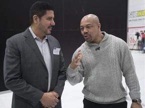 Anthony Calvillo, left, and Otis Grant, share a few thoughts while attending the Heads Up concussion conference at McGill on Jan. 27, 2017.