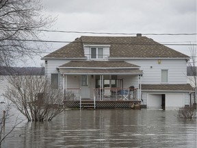 A home in Hudson was flooded by the overflowing Ottawa River on April 22, 2017. Despite the spring floods, waterfront properties remain popular.