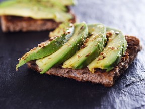 Sliced avocado on toast bread with spices