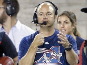 Montreal Alouettes defensive coordinator Noel Thorpe signals a formation during Canadian Football League game against the Hamilton Tiger-Cats in Montreal Friday July 15, 2016.