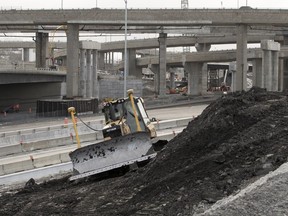 Crews work on the Ville-Marie Expressway connecting to the Decaire north ramp as part of the Turcot Interchange project in Montreal on Nov. 20, 2017.