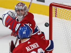 Canadiens goalie Carey Price and Karl Alzner watch puck sail past them earlier this month. Alzner says the team is ready to compete without Shea Weber in the lineup.