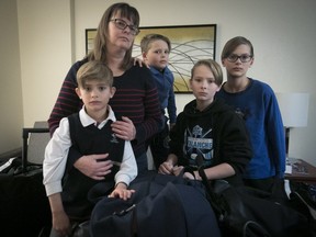 Frances Maxant in a Montreal hotel in June, with three of her four sons, from left: Radek, Marek and Lukas Korda. The family moved to a Marriott, which they are being asked to vacate.