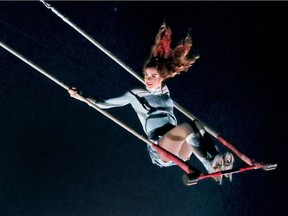 A figure skater performs on a trapeze during the debut of Cirque du Soleil's latest production Crystal at the Bell Centre in Montreal Wednesday Dec. 20, 2017.