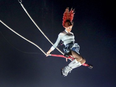 A figure skater performs on a trapeze during the debut of Cirque du Soleil's latest production Crystal at the Bell Centre in Montreal Wednesday Dec. 20, 2017.