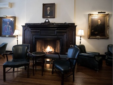 A fire burns in the second floor lounge at the University Club of Montreal on Tuesday December 19, 2017.