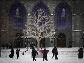 Tourists gather outside Notre-Dame church in Old Montreal Dec. 25, 2017.