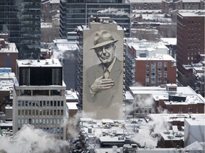 A mural of Leonard Cohen on the side of an apartment building on Crescent St. dominates the Montreal skyline from the lookout on Mount Royal Saturday December 30, 2017.