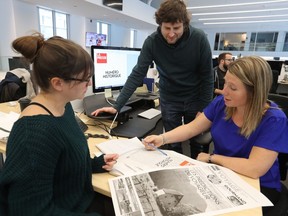 La Presse news editor Marie-Claude Mongrain, right, with graphic designer Camille Dussault and copy editor Sebastien Mathieu, go through the final printed mockup of their last printed edition of the newspaper on Friday December 29, 2017. The last rollout is set for Saturday morning, it will be replaced by the digital La Presse+.