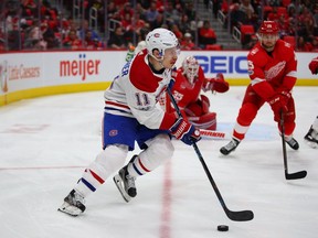 Brendan Gallagher of the Montreal Canadiens heads up ice in front of Jimmy Howard  of the Detroit Red Wings during the third period at Little Caesars Arena on November 30, 2017, in Detroit, Michigan. Montreal won the game 6-3.