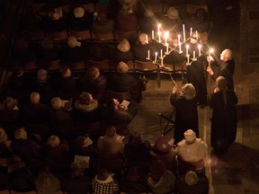 Candles are lit during the annual "darkness to light" advent procession on December 1, 2017 in Salisbury, England.