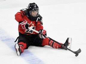 Marie-Philip Poulin of Canada controls the puck after falling to the ice on Dec. 3, 2017, at Xcel Energy Center in St Paul, Minn. Canada defeated the United States 2-1 in overtime.