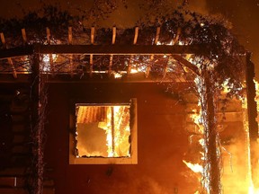 OJAI, CA - DECEMBER 07:  A home is consumed by fire during the Thomas fire on December 7, 2017 in Ojai, California. The Thomas fire has burned over 115,000 acres and has destroyed 439 structures.