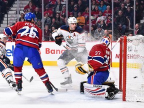 Milan Lucic (#27) of the Edmonton Oilers watches as the puck enters the net of goaltender Antti Niemi (#37) of the Montreal Canadiens during a NHL game at the Bell Centre on December 9, 2017 in Montreal.