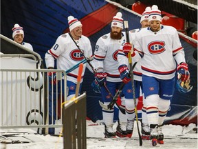 Canadiens' Shea Weber, Karl Alzner, Jordie Benn and Nicolas Deslauriers make their way to the ice surface on Friday afternoon for practice at Lansdowne Park in Ottawa.