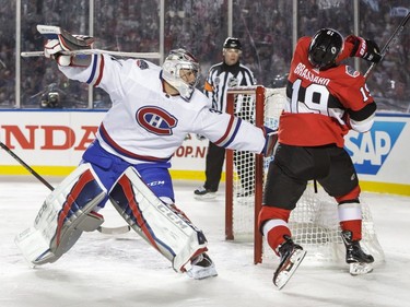 Derick Brassard (19) of the Ottawa Senators collides with Carey Price of the Montreal Canadiens at the 2017 NHL 100 Classic at Lansdowne Park on Saturday, Dec. 16, 2017, in Ottawa.