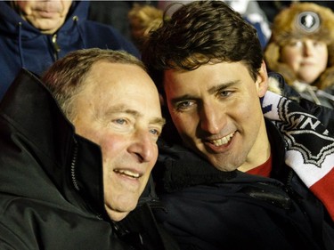 Gary Bettman, left,  commissioner of the NHL chats with Justin Trudeau, prime minister of Canada, during the 2017 NHL100 Classic between the Ottawa Senators and the Montreal Canadiens at Lansdowne Park on Saturday, Dec. 16, 2017, in Ottawa.