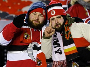 Fans pose for a photo following a game between the Senators and the Canadiens during the 2017 NHL 100 Classic at Lansdowne Park on Saturday, Dec. 16, 2017, in Ottawa.