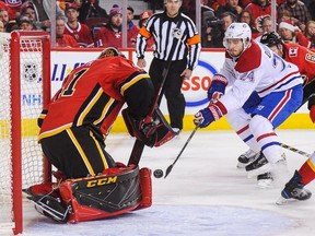 Flames goalie Mike Smith stymies Canadiens' Phillip Danault. Danualt leads Montreal with 21 points, which ranks only 134th in the NHL.