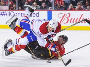 Canadiens' Andrew Shaw checks Flames' Michael Stone at Scotiabank Saddledome on Friday, Dec. 22, 2017, in Calgary.