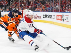 EDMONTON, AB - DECEMBER 23: Matthew Benning #83 of the Edmonton Oilers pursues Brendan Gallagher #11 of the Montreal Canadiens at Rogers Place on December 23, 2017 in Edmonton, Canada.