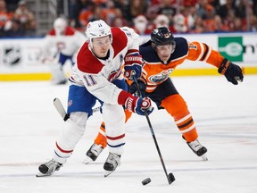 Oilers' Mike Cammalleri  pursues Canadiens' Brendan Gallagher at Rogers Place on Saturday, Dec. 23, 2017, in Edmonton.