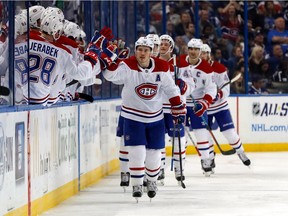 The Canadiens’ Brendan Gallagher is congratulated by his teammates after scoring his team-leading 15th goal of th season against the Lightning at Tampa's Amalie Arena on Dec. 28, 2017.