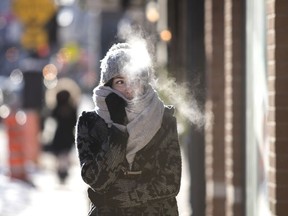 Roxane Roulin bundles up as the temperature in Montreal in mid-December. Dec. 27 is shaping up as the coldest day-after-Boxing-Day since 1993.