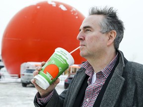 Montreal writer Kristian Gravenor has just published a new book: Montreal: 375 Tales of Eating, Drinking, Living and Loving. He is seen outside the Orange Julep, one of the spots mentioned in his book, on Friday, Dec. 15, 2017.