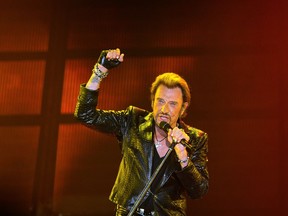 This file photo taken on June 2, 2013 shows French singer Johnny Hallyday performing in Bordeaux. France's best-known rock star Johnny Hallyday has died aged 74 after a battle with lung cancer.