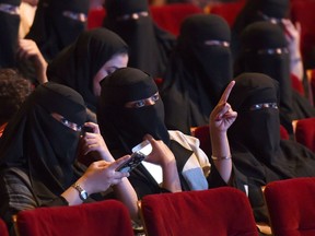 This file photo taken on October 20, 2017 shows Saudi women attending the "Short Film Competition 2" festival at King Fahad Culture Center in Riyadh. Saudi Arabia on Monday announced a lifting of the kingdom's decades-long ban on cinemas, a landmark decision part of a series of social reforms ushered in by the powerful crown prince.