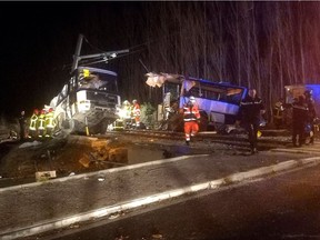 A handout picture taken on December 14, 2017 and released on December 15, 2017 by France Bleu shows rescue workers at the site of an accident after a train crashed into the school bus at a level crossing, in Millas, near Perpignan, southern France. The death toll from the crash between a school bus and a train in southern France rose to six on December 15 as two 11-year-old girls succumbed to their injuries, a police source said. Four teenagers had died on December 14 in the accident at a level crossing in Millas, a village near the city of Perpignan. Eighteen others were injured, 14 of them children.