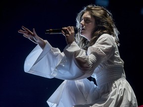 A downpour didn't dampen Lorde's spirits at the Osheaga festival.