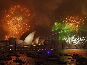 Fireworks explode over Sydney Harbour during New Year's Eve celebrations in Sydney, Australia, Sunday, Dec. 31, 2017. (David Moir/AAP Image via AP)