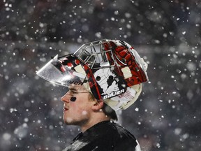 Canada goalie Carter Hart takes a breather during Friday's outdoor game versus Team USA.