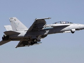 U. S. Air Force F-18 Super Hornet fighter aircraft takes off at the opening ceremony of Aero India 2011 in Yelahanka air base on the outskirts of Bangalore, India, Wednesday, Feb. 9, 2011. Boeing is weighing in on the Trudeau government's plan to buy used Australian fighter jets, saying it respects the decision while dispelling any suggestions it may drop its trade dispute with Canadian rival Bombardier.