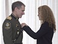 Martin Prud'homme, newly appointed interim chief of police in Montreal, is decorated of as Officer of the Order of Merit of the Police Forces by Gov. Gen. Julie Payette at Citadelle in Quebec City Dec. 7, 2017.