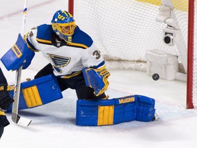 The puck flies into the net past St. Louis Blues goalie Jake Allen on a goal by Montreal Canadiens' Shea Weber, not seen, during second period NHL hockey action in Montreal on Tuesday, December 5, 2017.