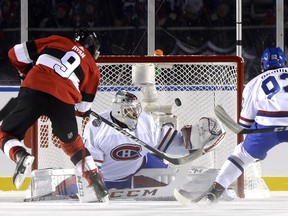 Senators' Bobby Ryan puts the puck past Canadiens goalie Carey Price at the NHL 100 Classic in Ottawa on Saturday, Dec. 16, 2017.