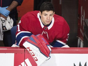 Montreal Canadiens goaltender Carey Price looks on from the bench during second period NHL hockey action against the Edmonton Oilers in Montreal, Saturday, December 9, 2017.