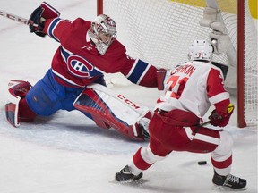 Detroit Red Wings' Dylan Larkin moves in on Canadiens goaltender Carey Price in Montreal on Saturday, Dec. 2, 2017.