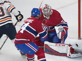 Edmonton Oilers' Michael Cammalleri (13) scores against Canadiens goaltender Carey Price as Canadiens' Tomas Plekanec defends during first period NHL hockey action in Montreal, Saturday, Dec. 9, 2017.