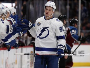 Tampa Bay Lightning defenseman Mikhail Sergachev is congratulated by teammates after scoring a goal against the Colorado Avalanche in Denver on Dec. 16, 2017.