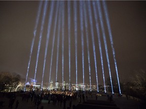 Fourteen beams of light shine from Mount Royal during a ceremony Wednesday evening remembering the victims of the Polytechnique massacre.