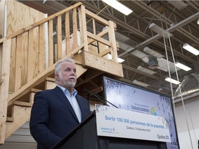Quebec Premier Philippe Couillard speaks at news conference at a physical rehab centre in Quebec City on Sunday, Dec. 10, 2017.