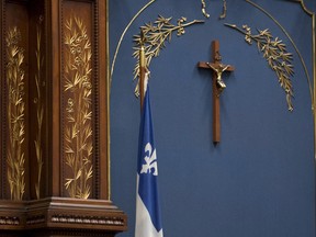 Quebec legislature Speaker Jacques Chagnon speaks before question period, Wednesday, September 18, 2013 at the legislature in Quebec City. A proposed Quebec charter of values would allow the crucifix inside the legislature but would ban all religious signs in government buildings. THE CANADIAN PRESS/Jacques Boissinot