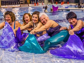 A group of mermaids in training; tail rental is included in the lessons offered by AquaSirene.