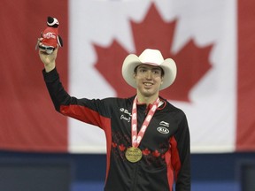 Alex Boisvert-Lacroix of Sheerbrooke celebrates his win the the men's 500-metre Division A competition at the ISU World Cup Speedskating event, in Calgary on Sunday, Dec. 3, 2017.