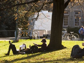 Students bask outdoors in November 2015 at Western University. School, writes Aly Kamadia, isn't always the best bet, especially when it comes to PhDs. Mike Hensen/The London Free Press